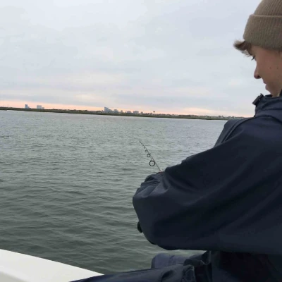 Paul Wheaton fishing off the side of a boat