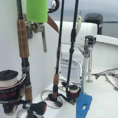 More fishing rods in rod holders on a boat