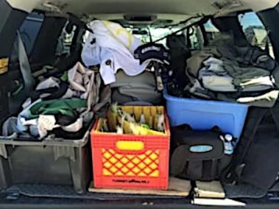 a view of a Ed Bergers trunk filled with fishing gear