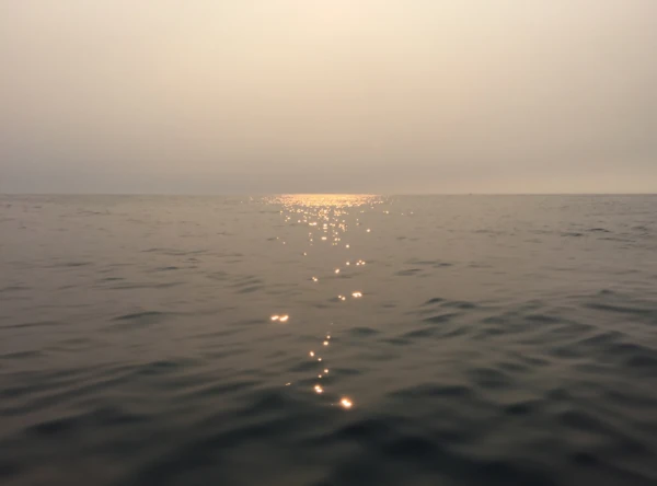 a view of the ocean at sunset