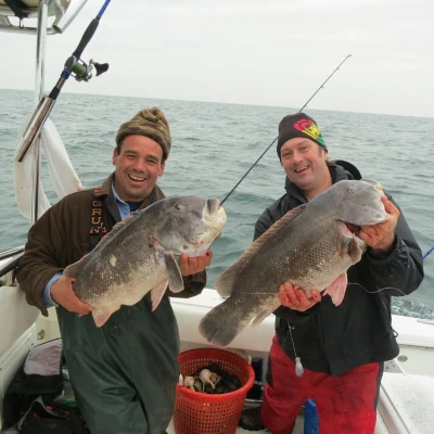 Nick Honachefsky and another angler holding blackfish