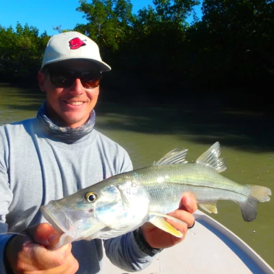Captain Mike Venezia holding a small snook