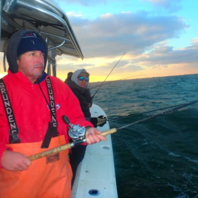 Two anglers fishing from a boat