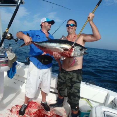 Nick Honachefsky and another angler holding a bluefin tuna on a boat