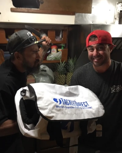 Two guys with a TackleDirect waterproof boat bag