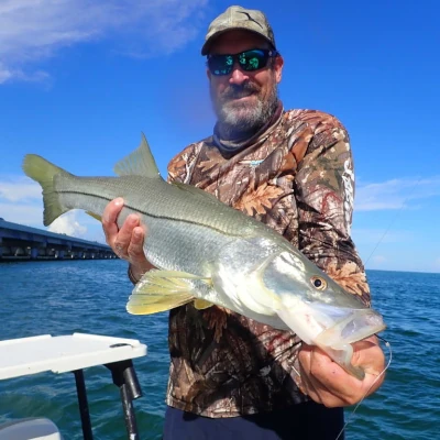 Captain Max Gaspeny holding a snook