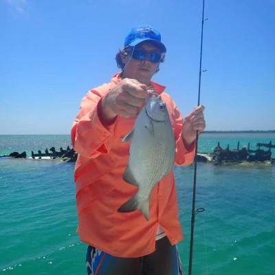 An angler holding a fish