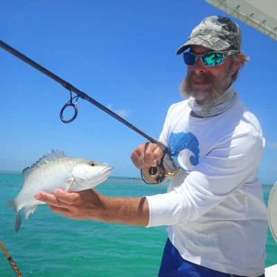 An angler holding a fish