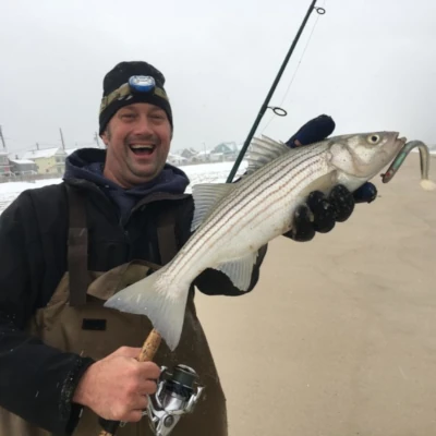 Nick Honachefsky holding a striped bass