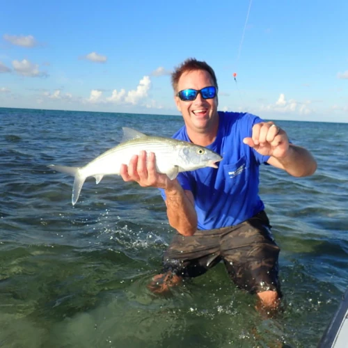 Nick Honachefsky holding a bonefish he just caught