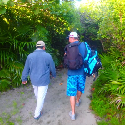 Nick Honachefsky and another man walking from the beach