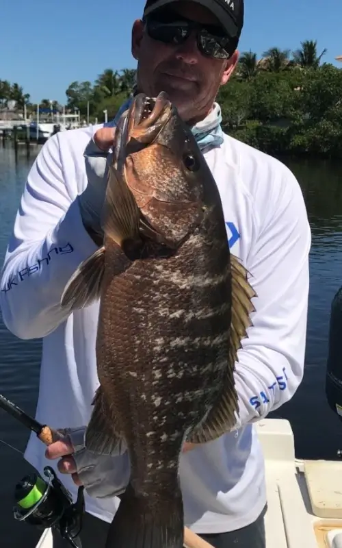 Capt. Mike Haines holding a fish