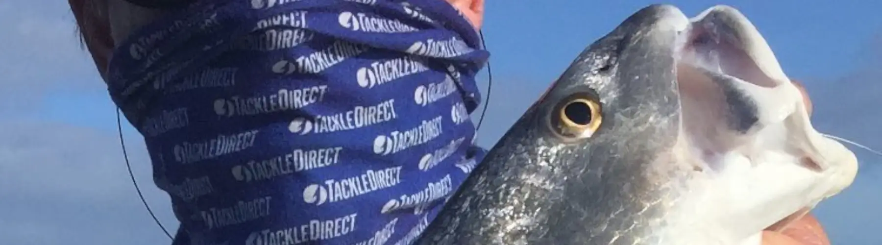 Close-up of an angler holding a fish