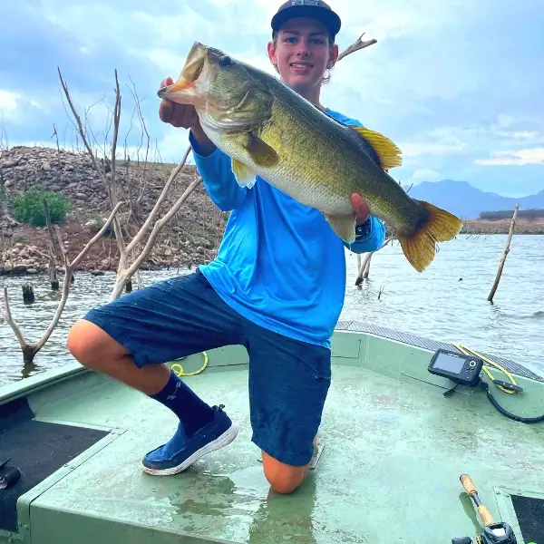 Carter Doren holding a bass