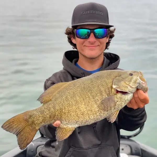 Nicholas Dellaporta holding a bass